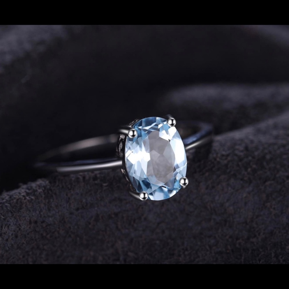 Blue topaz solitaire ring